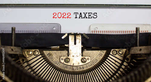 2022 taxes New Year symbol. Words '2022 taxes' typed on retro typewriter. Business and 2022 taxes New Year concept. Copy space.