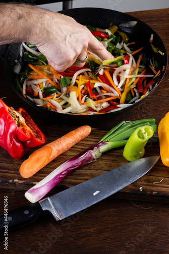 Sauteed colorful vegetables, rustic pan. bell pepper, carrot, onion. fajitas