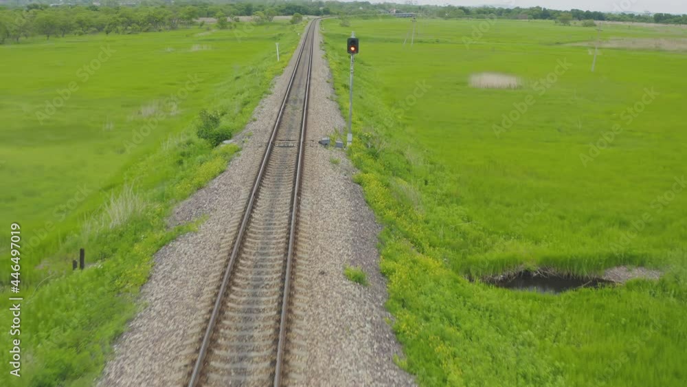 Empty straight one-way railways on a summer sunny day Empty straight one-way railways on a summer sunny day