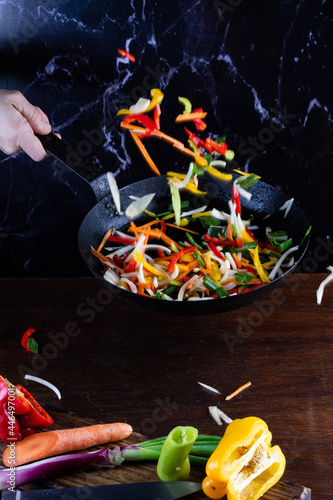 Sauteed colorful vegetables, rustic pan. bell pepper, carrot, onion. fajitas