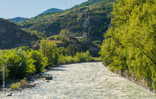 Beautiful late afternoon sight of the Dora Baltea river near Aosta. Aosta Valley, northern Italy. photo