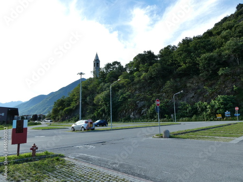 Campanile con montagna di Piantedo in Valtellina photo