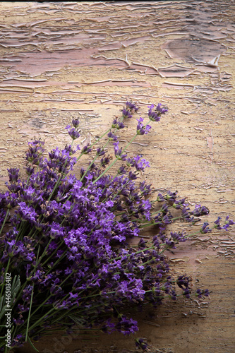 Lavender flower on grunge wooden table. Summer flower background.