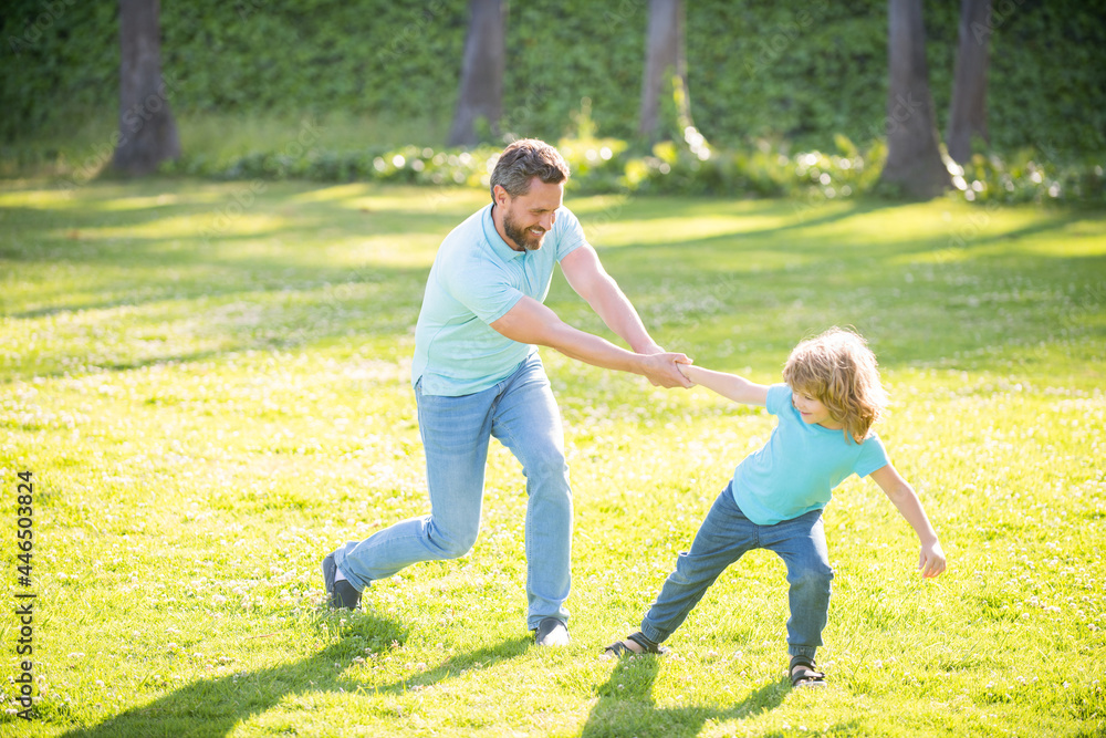 Happy father man and son child have fun summer outdoors, family