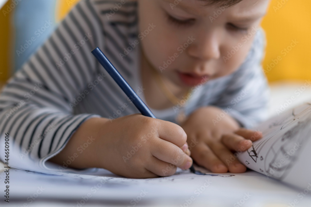 smart smiling preshool toddler children boy and girl draw with pencils lying on their stomach at yellow bed. little cute reader have fun, happy kid on quarantine at home. Friendship, family, education smart smiling preshool toddler children boy and girl draw with pencils lying on their stomach at yellow bed. little cute reader have fun, happy kid on quarantine at home. Friendship, family, education