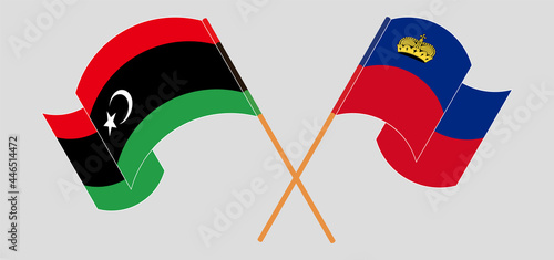 Crossed and waving flags of Libya and Liechtenstein
