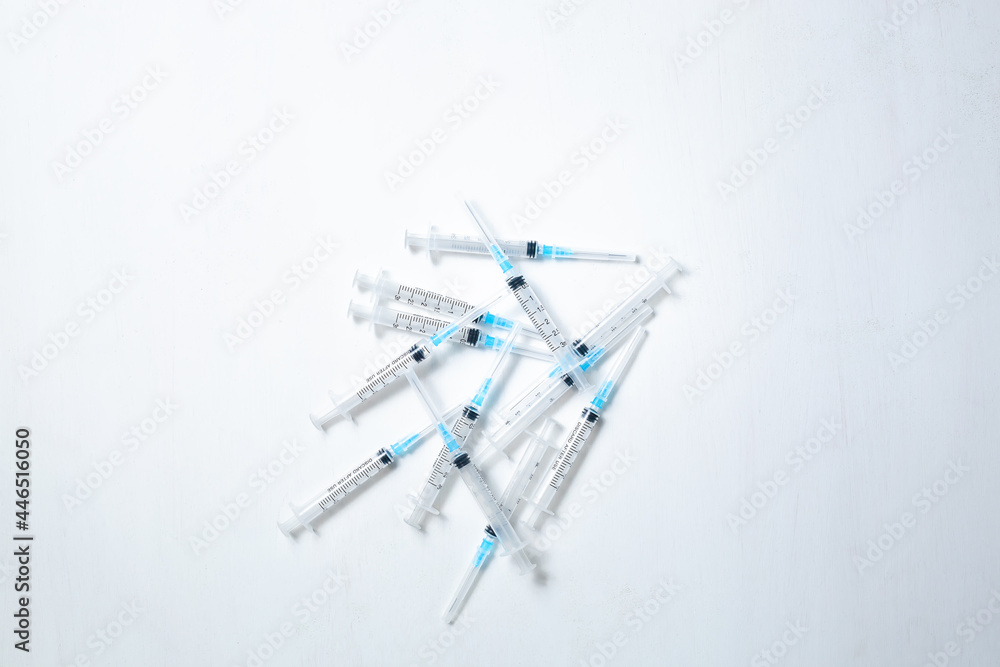 A hypodermic injection syringe. Syringes with blue needles. Medical Injectors. Copy space A hypodermic injection syringe. Syringes with blue needles. Medical Injectors. Copy space