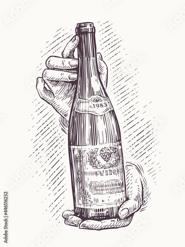 Bottle of wine in hands in vintage style. Hand drawn sketch vector illustration