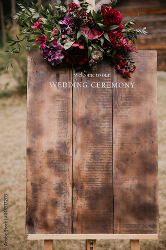 Handmade wooden board with welcome sign on it