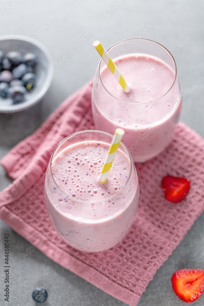 Fresh milkshake with berries in glasses Fresh milkshake with berries in glasses