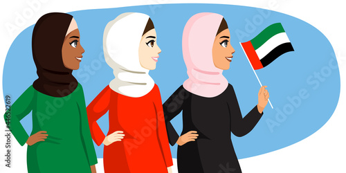 Three beautiful women on Emirati women's day holiday wearing hijab together