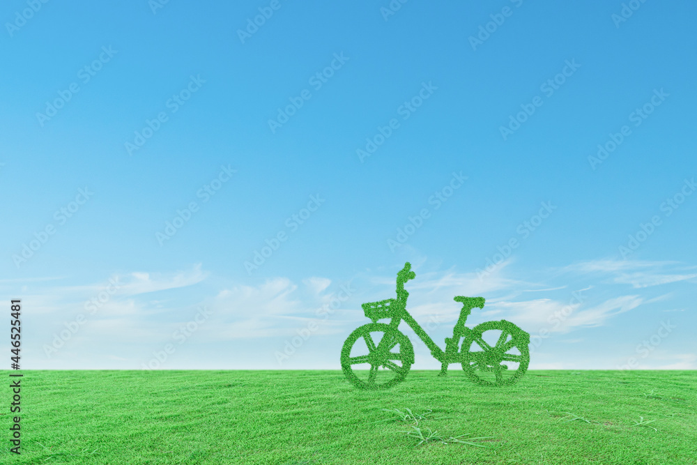 Green ecological bicycle on grass field and blue sky background. Environmentally friendly concept Green ecological bicycle on grass field and blue sky background. Environmentally friendly concept