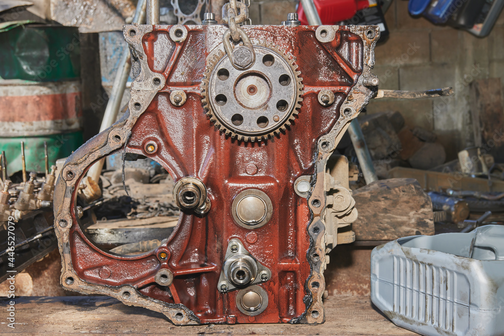 Front View of Car Engine and Camshaft Sprocket and Bolt and Chain in Car Repair Shop Front View of Car Engine and Camshaft Sprocket and Bolt and Chain in Car Repair Shop