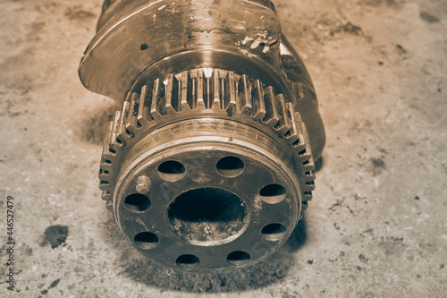 Black and White Center Frame Zoom View Crankshaft Gear of Truck Engine on Concrete Floor