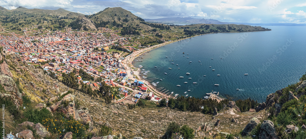 Fototapeta premium Aerial panoramic view of Copacabana town. Titicaca lake and mountains. Cityscape. La Paz Department, Bolivia