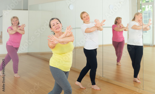 Elderly women having dance training in studio, practicing active dances, healthy lifestyle