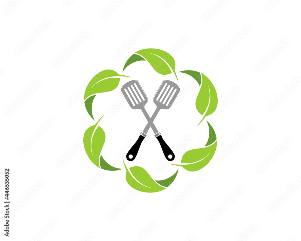 Spatula crossed inside the circular nature leaf Spatula crossed inside the circular nature leaf