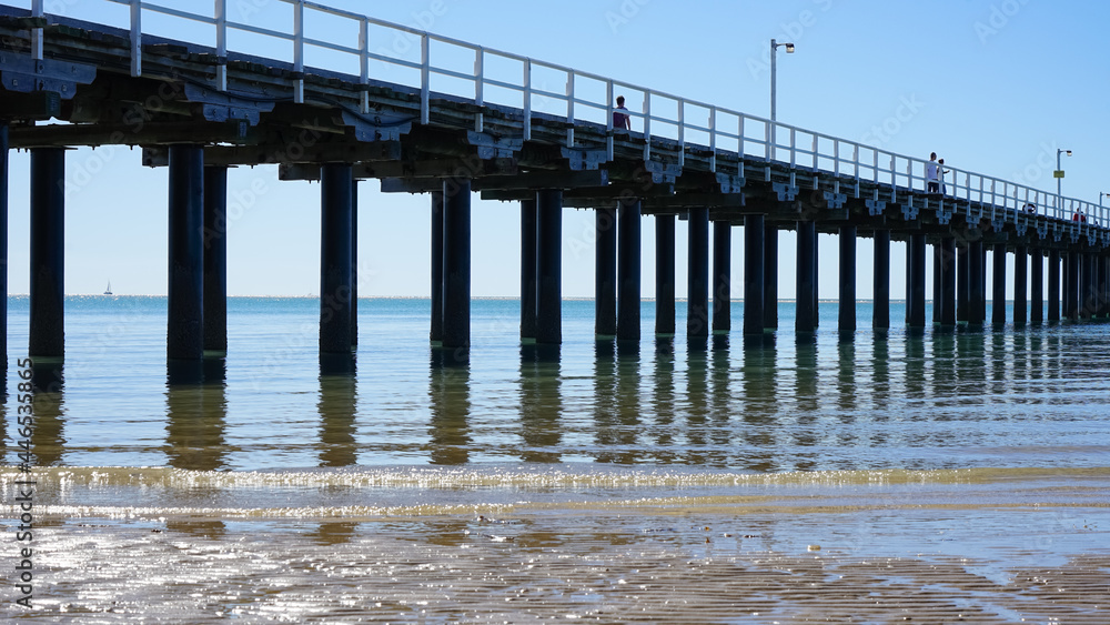 Gentle waves lapping the shoreline beside the Urangan Pier at Hervey Bay, Queensland, Australia. Gentle waves lapping the shoreline beside the Urangan Pier at Hervey Bay, Queensland, Australia.