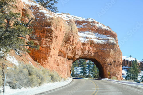 Winter in the American Southwest. Snow Covered Redrock Cliffs Driving Tourism