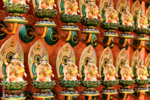 Wall with Buddha statues inside the Buddha Tooth Relic Temple © efired