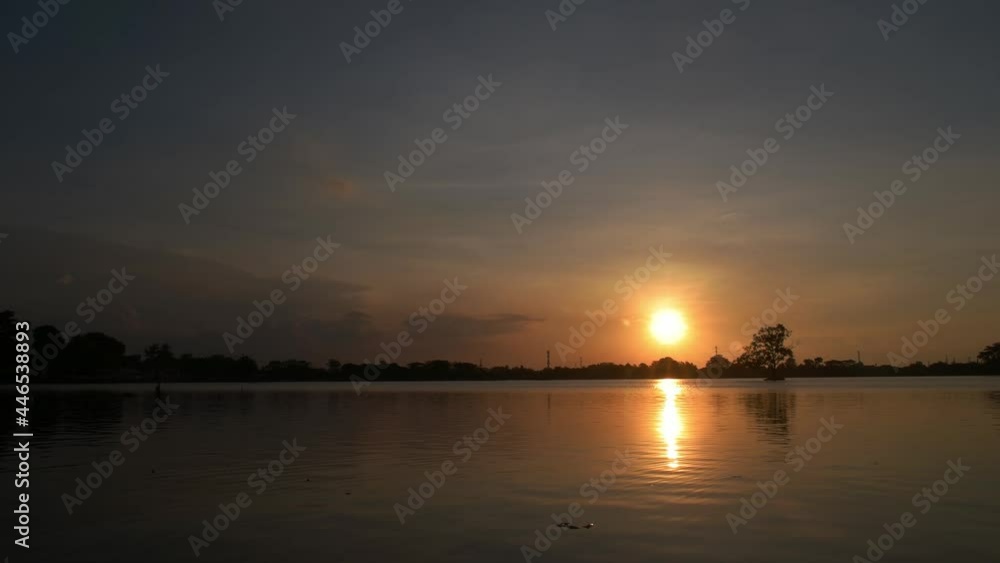 the atmosphere or atmosphere when the sun is about to set on the surface of the lake, sunset. the atmosphere or atmosphere when the sun is about to set on the surface of the lake, sunset.
