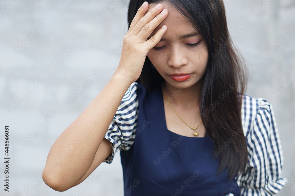 Fatigue overworked stressful female model keeps hands on temples, suffers from terrible headache, feels pain, wears pink shirt,Tiredness cocnept Fatigue overworked stressful female model keeps hands on temples, suffers from terrible headache, feels pain, wears pink shirt,Tiredness cocnept