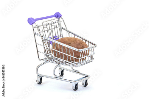 potatoes in supermarket trolley on white background