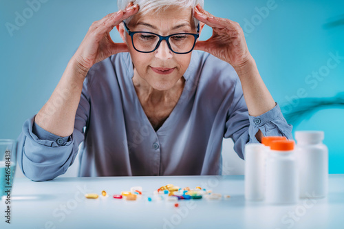Senior patient failing to follow medical advice, demonstrating prescribed medicine non-adherence behavior.