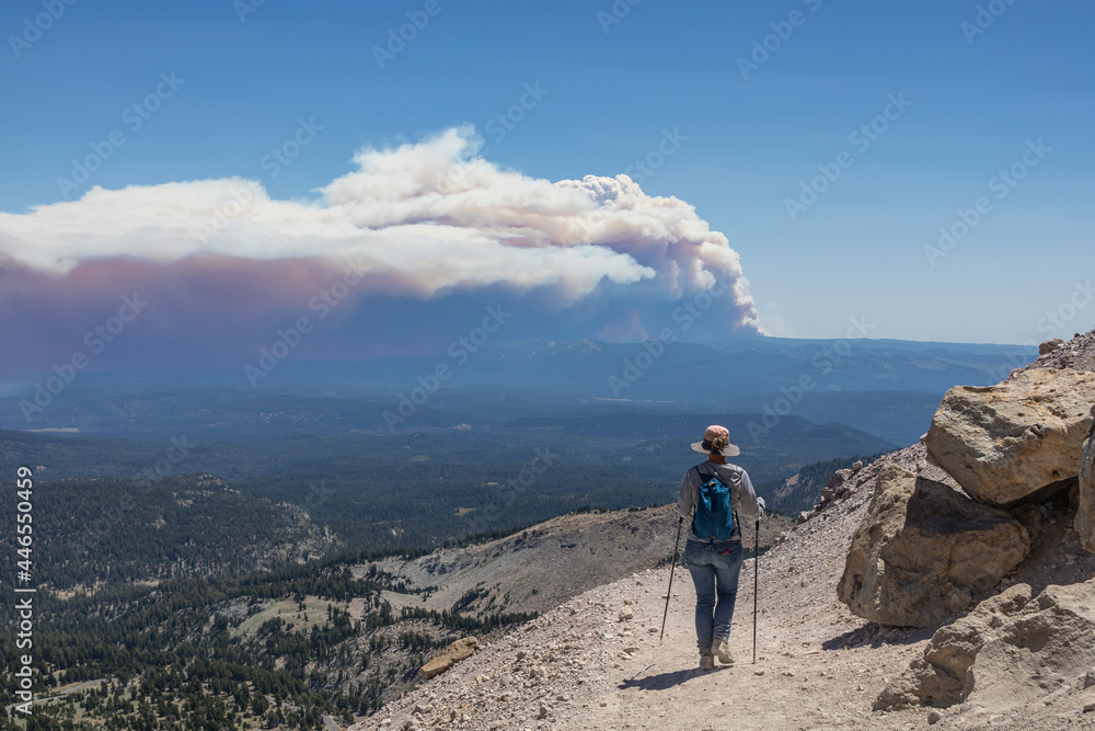 A Hiker Views the Dixie Fire's Pyrocumulonimbus Cloud from Lassen Peak