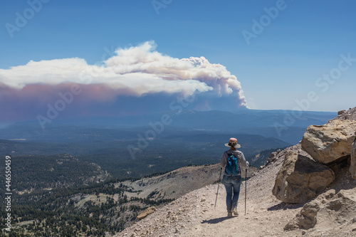 A Hiker Views the Dixie Fire's Pyrocumulonimbus Cloud from Lassen Peak
