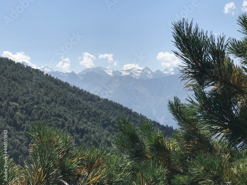 Svaneti, Georgia in September: high mountains covered with snow with green scenery