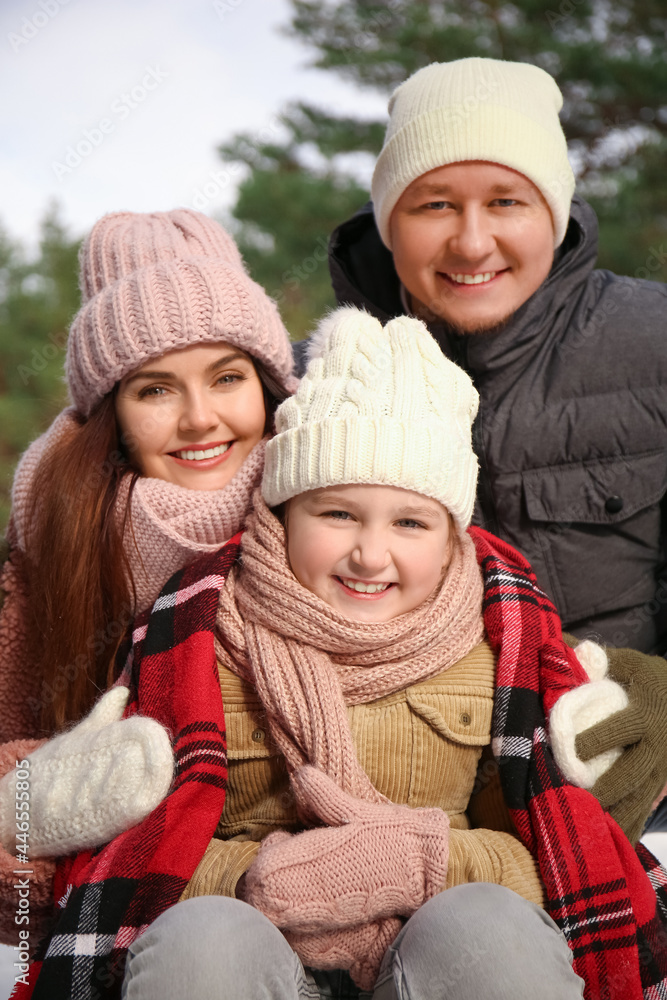 Happy family in park on winter day Happy family in park on winter day