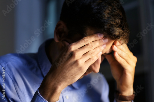 Tired businessman working i...
