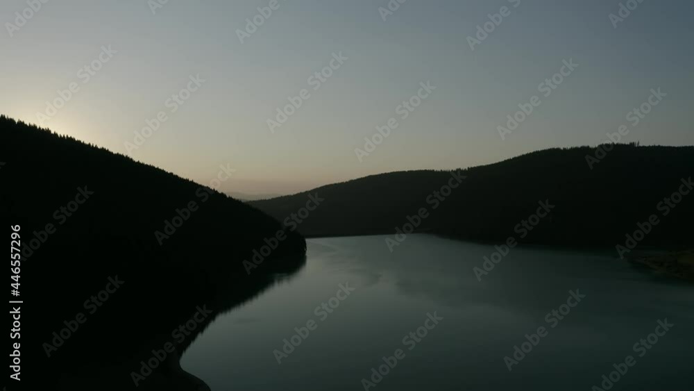 Calm Waterscape Of Frumoasa Dam During Golden Sunset In Frumoasa, Harghita County, Romania