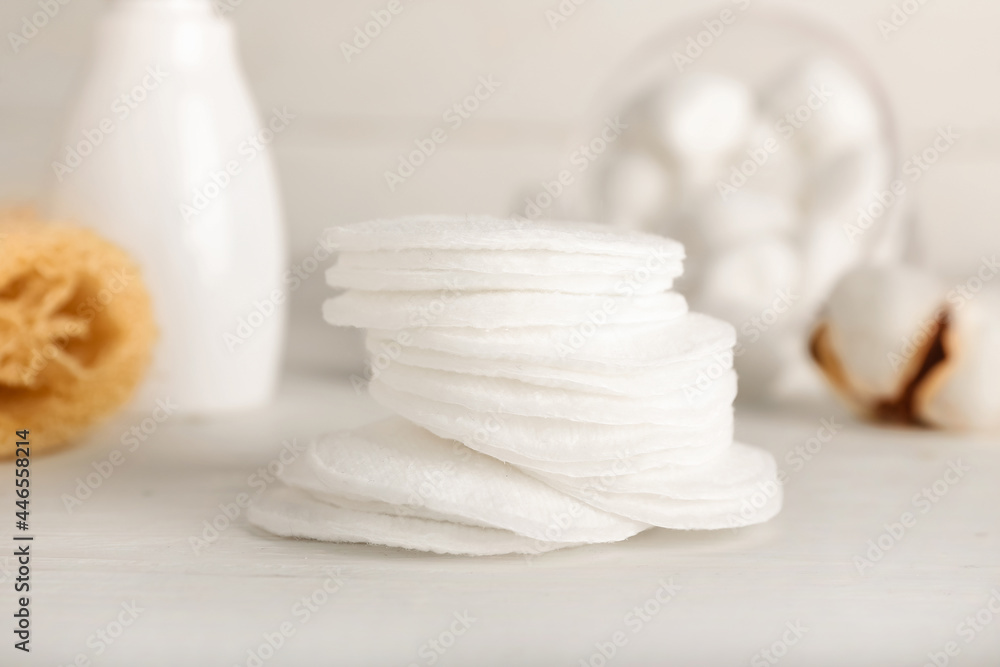 Cotton pads on light background, closeup Cotton pads on light background, closeup