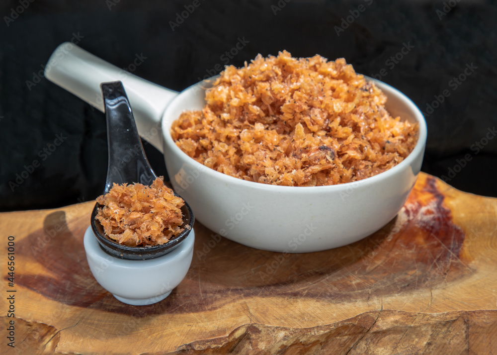 Shrimp paste with Dried shrimps in white Ceramic Bowl on Wooden plank. Copy space, Selective focus. Shrimp paste with Dried shrimps in white Ceramic Bowl on Wooden plank. Copy space, Selective focus.