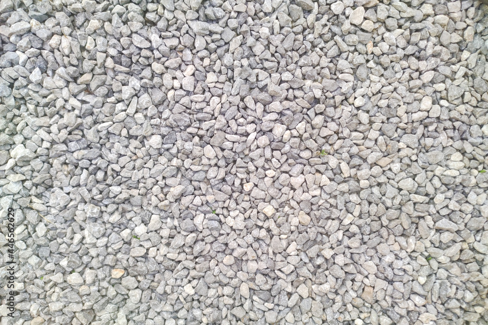 Gray gravel pattern texture. Small rocks closeup. Crushed stone surface background Gray gravel pattern texture. Small rocks closeup. Crushed stone surface background