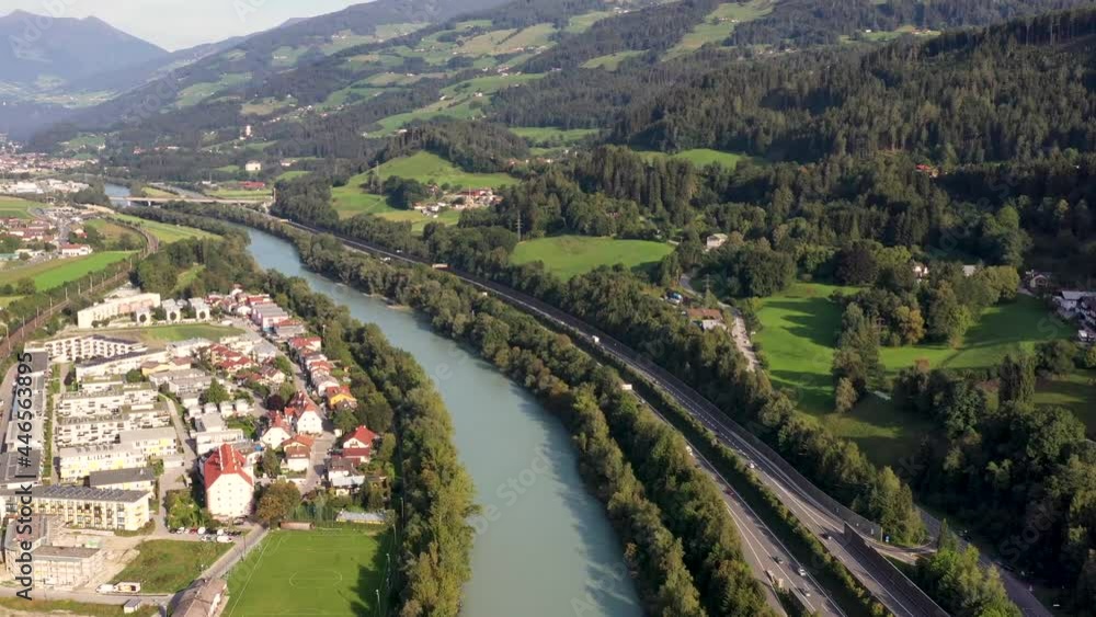 Aerial view of mountain town in Austria witha river, colorful houses, towers, summer scenery, Austrian Alps from above, Austria, Europe Aerial view of mountain town in Austria witha river, colorful houses, towers, summer scenery, Austrian Alps from above, Austria, Europe