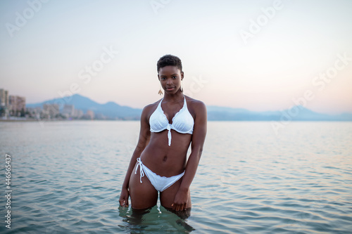 Black woman with short hair in the sea