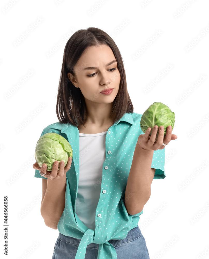 Young woman with fresh cabbages on white background Young woman with fresh cabbages on white background
