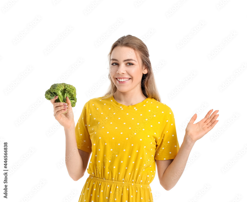 Young woman with fresh broccoli on white background Young woman with fresh broccoli on white background