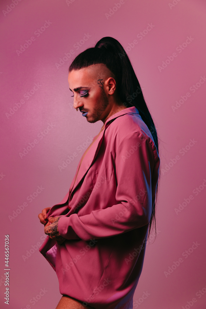 Stylish transgender woman posing at studio