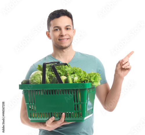 Young man with fresh vegeta...