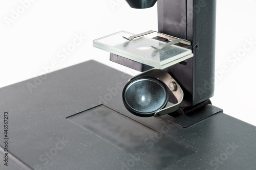 microscope substage mirror for reflecting light to illuminate the reserch object on stage with slide glasses photo
