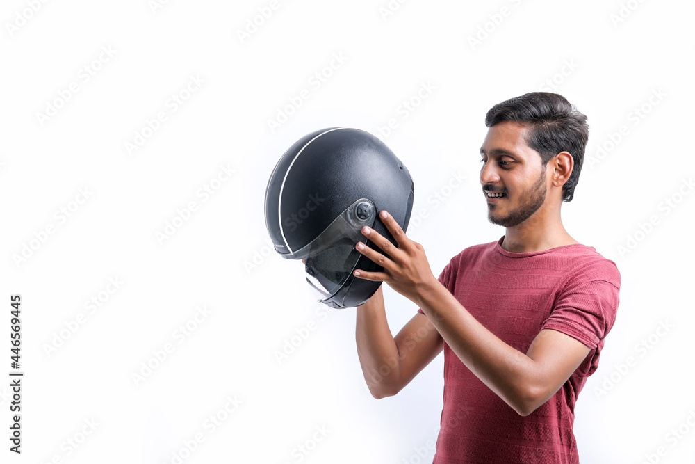 Motorbike concept Young man with black helmet on white background. Motorbike concept Young man with black helmet on white background.