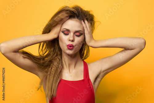 pretty woman in red t-shirt cosmetics decoration fashion yellow background