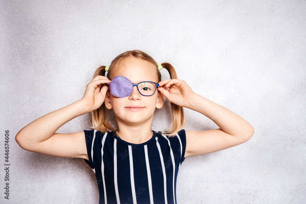 Happy little girl wearing glasses and eye patch or occluder, amblyopia  (lazy eye) treatment Stock Photo | Adobe Stock