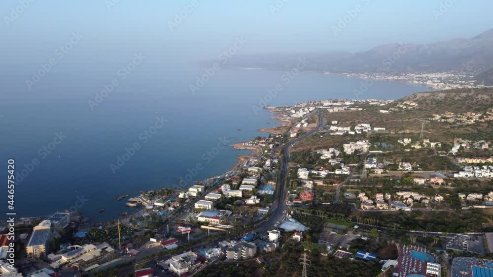 Aerial over the Crete coast, Hersonissos, Greece, foggy summer day Aerial over the Crete coast, Hersonissos, Greece, foggy summer day