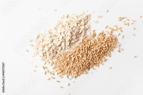 Flakes and peeled oat grains pile