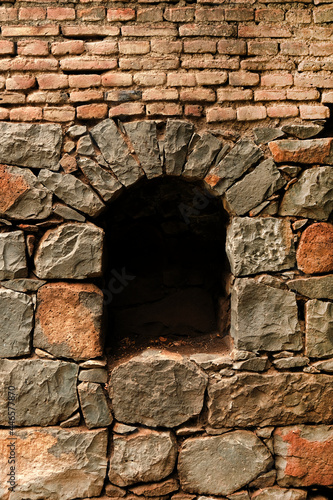 View from the ancient stone window, Medieval stone arch, Medieval arch in stone wall © Vinayak Jagtap
